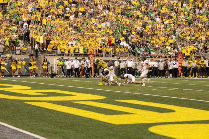 Oregon tight end Terrance Ferguson battles through multiple tackles en route to one of two touchdowns against Eastern Washington.